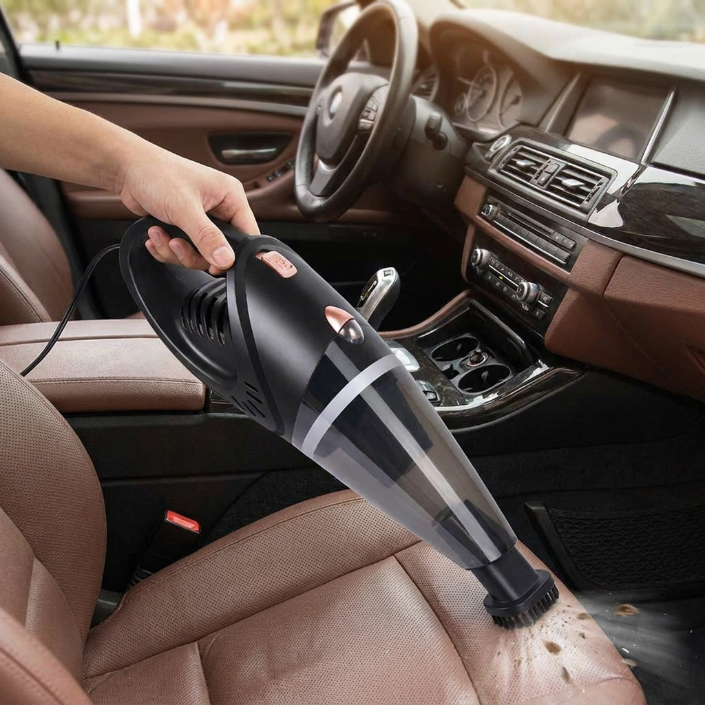 Person using a portable car vacuum cleaner in a car - lifestyle